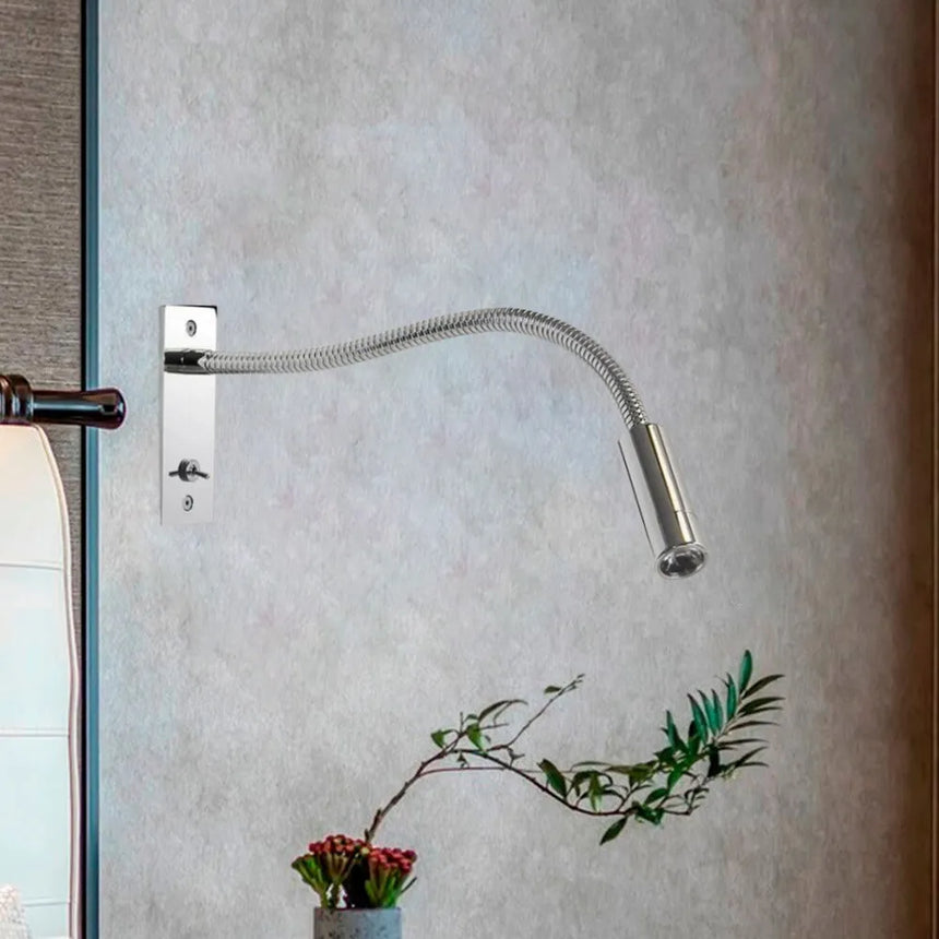 Gold metal wall sconce warm LED light close-up