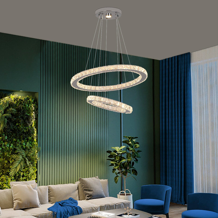 crystal chandelier lit in dining room setting