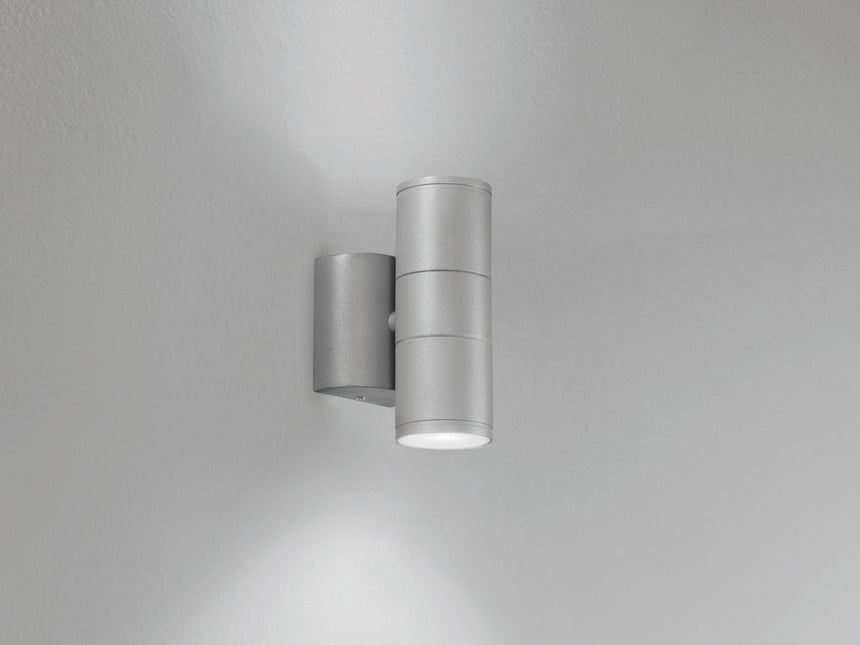 Twin head wall lamp shown at night