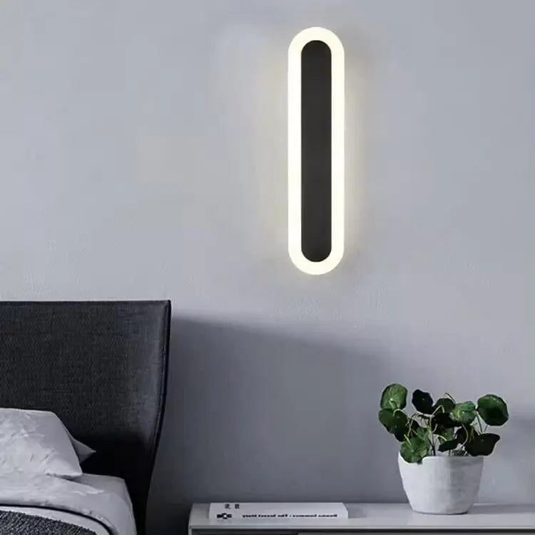 Black wall light mounted on exterior brick