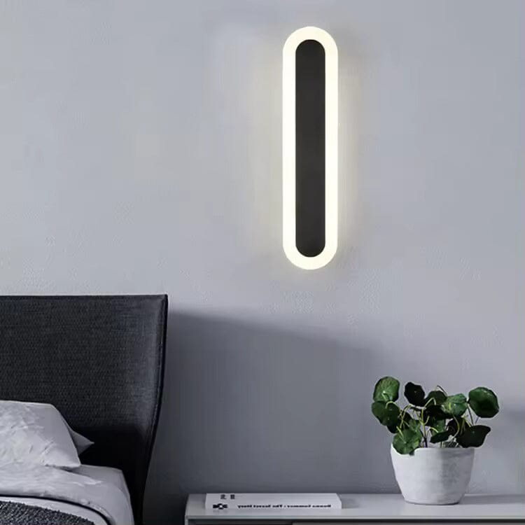 Black wall light mounted on exterior brick