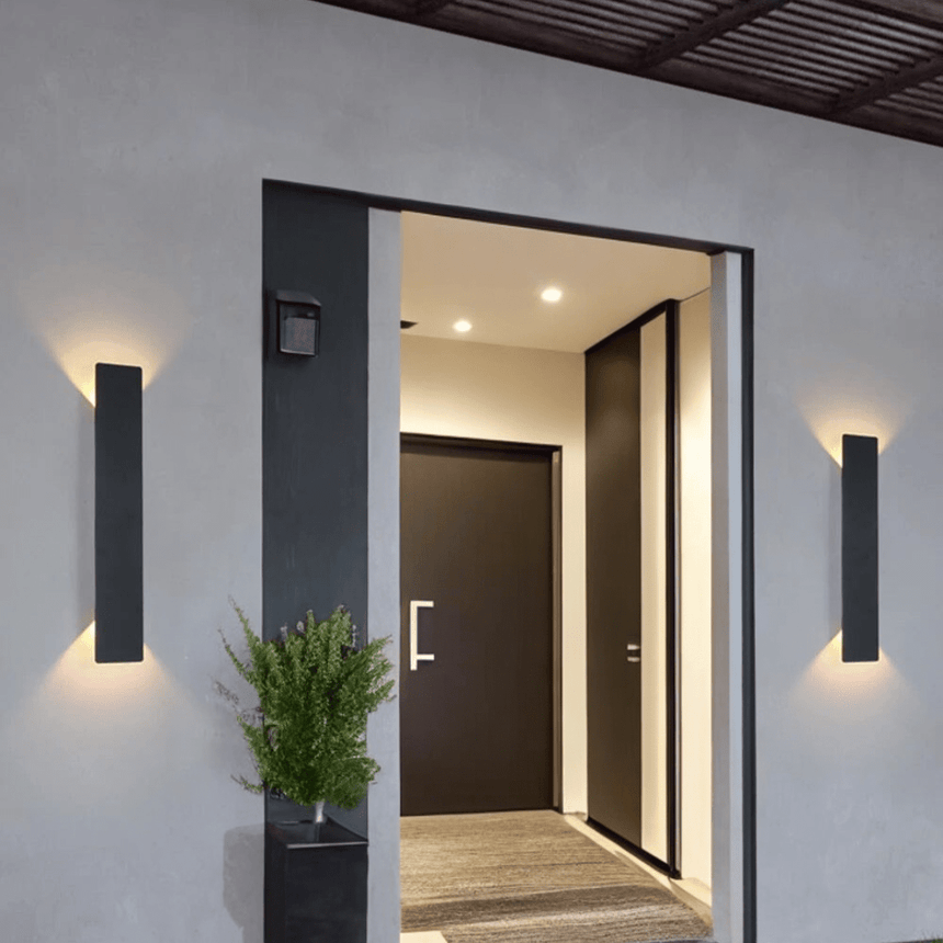 Outdoor wall lamp shown at dusk