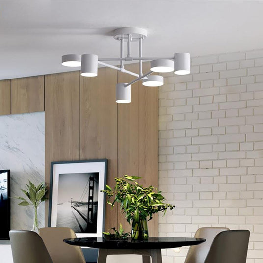 Round Chandelier Installed Above Dining Table