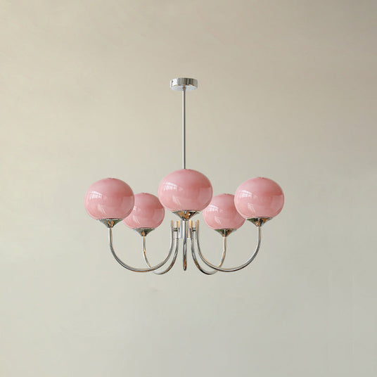 Glass shade chandelier detail with golden metal arms