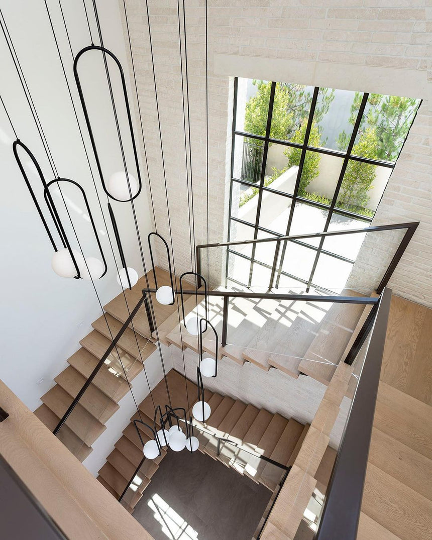 Glass Pendant Light Installed In Living Room Setting - OroDwell
