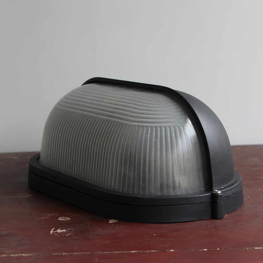 Outdoor wall sconce with weather-resistant design