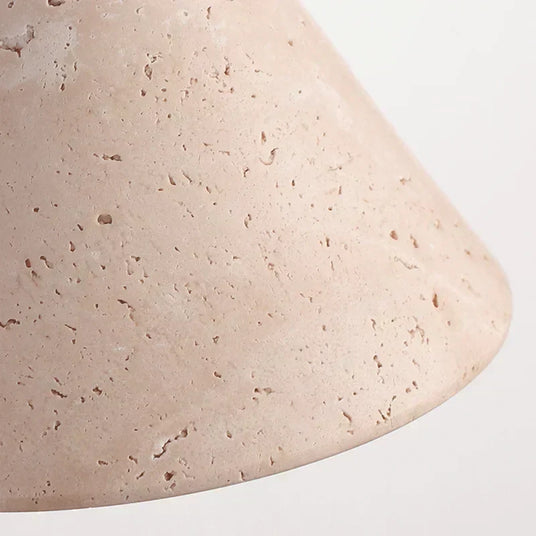 Perforated stone wall light fixture
