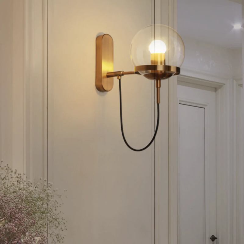 Black and gold wall sconce for entryway