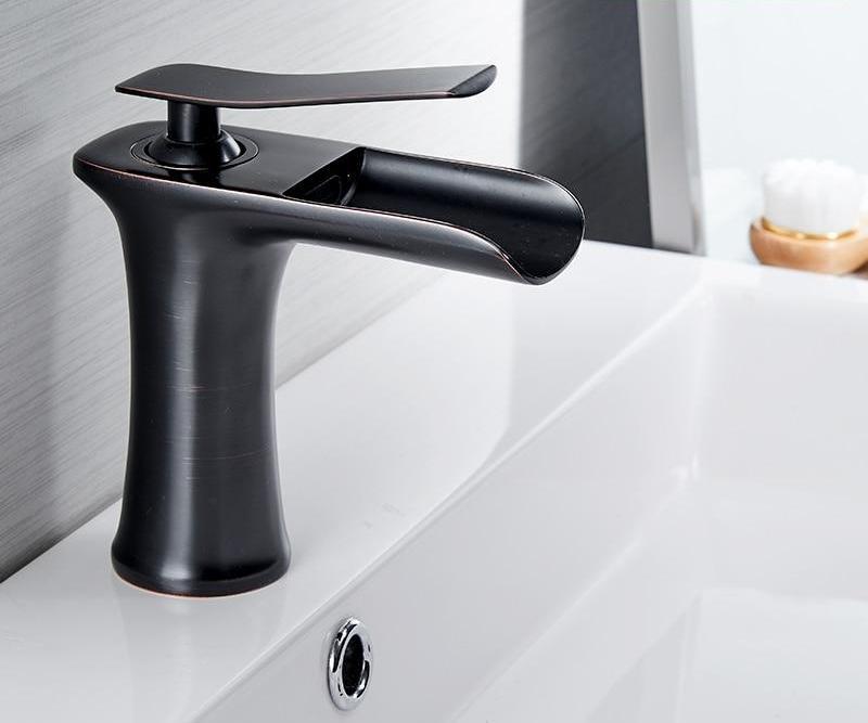 Brass waterfall bathroom faucet for small bathroom spaces
