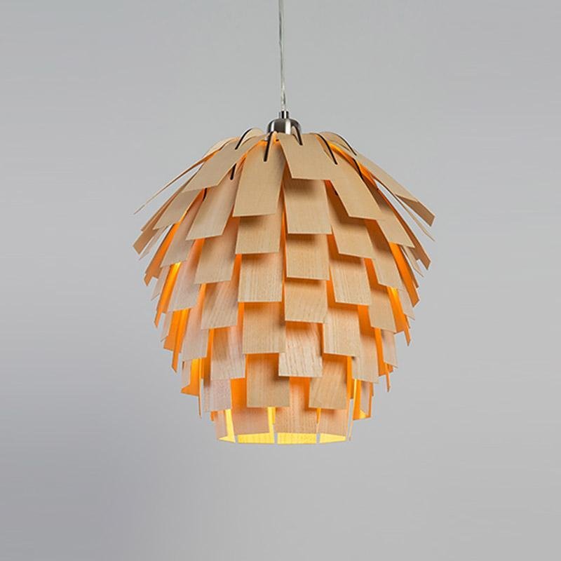 Wood pendant light installed above dining table