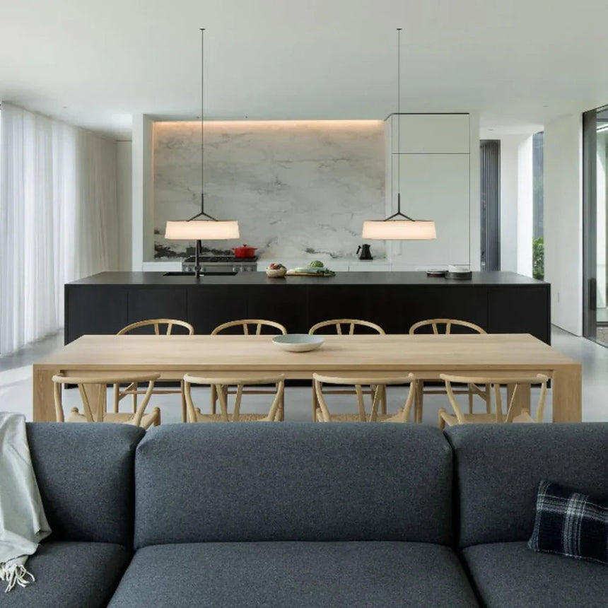 Two flat drum shades above a kitchen island