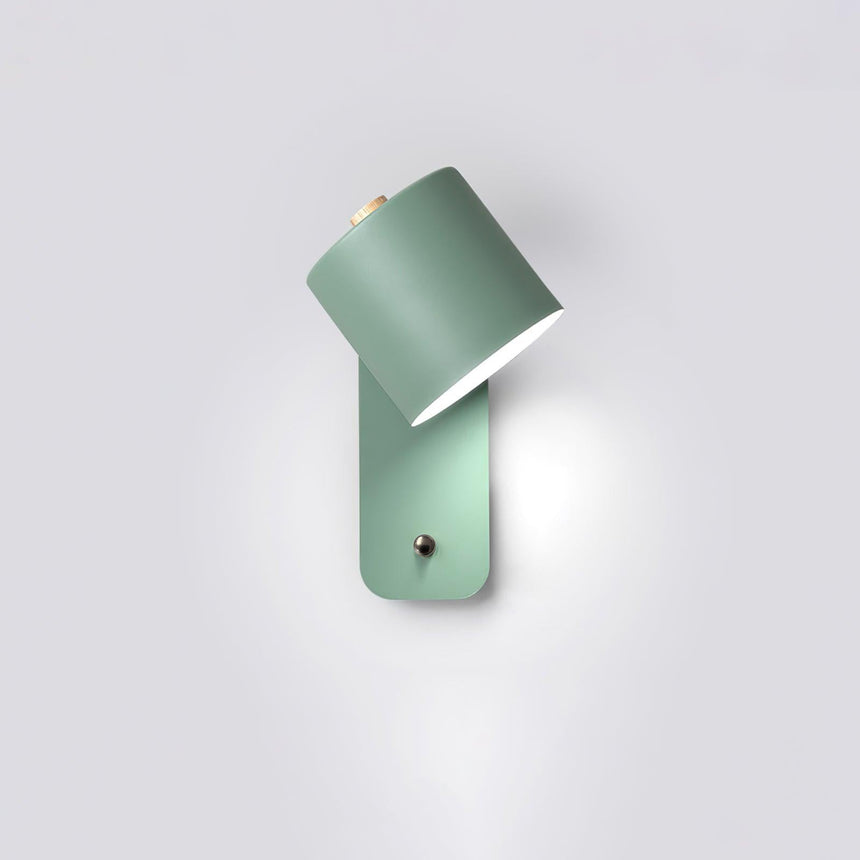 The green version seen at an angle, the cylinder tilted out from its plate