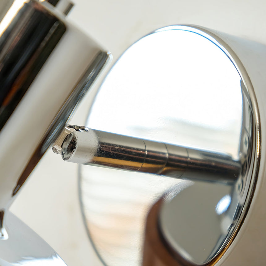 Close view of the polished reflector inside the head of the fitting