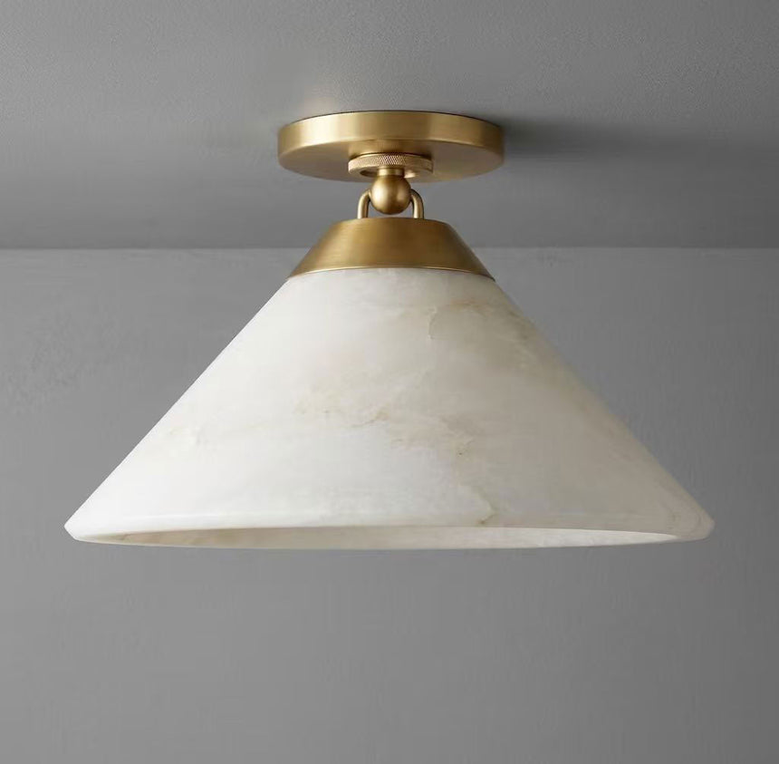 Brass finish alabaster cone ceiling light shown close up against a plain background