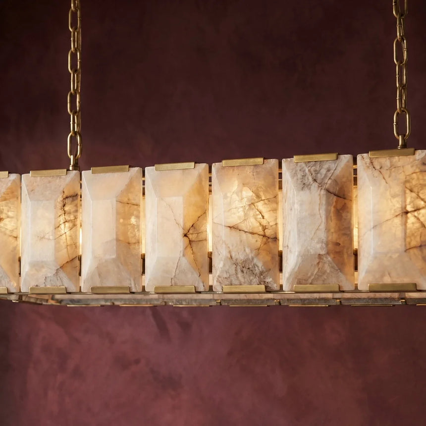 The lit panels seen close against a deep burgundy wall