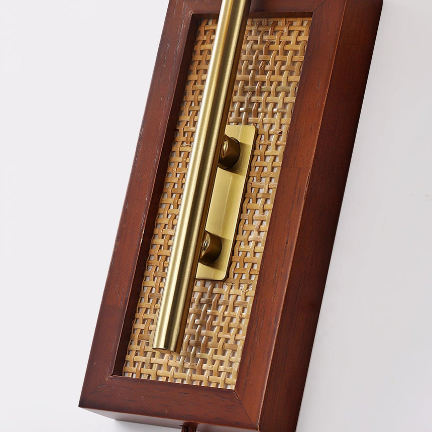 The walnut back plate with its cane inlay and the arm bracket, photographed close