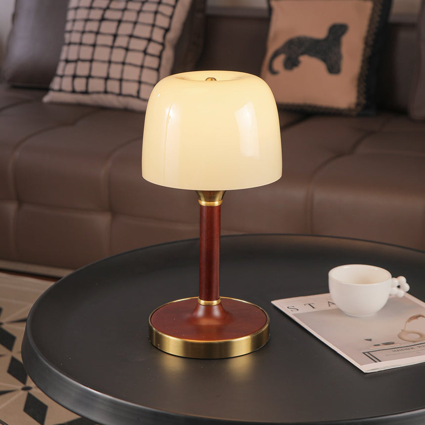 The white glass version lit close, the dome glowing evenly