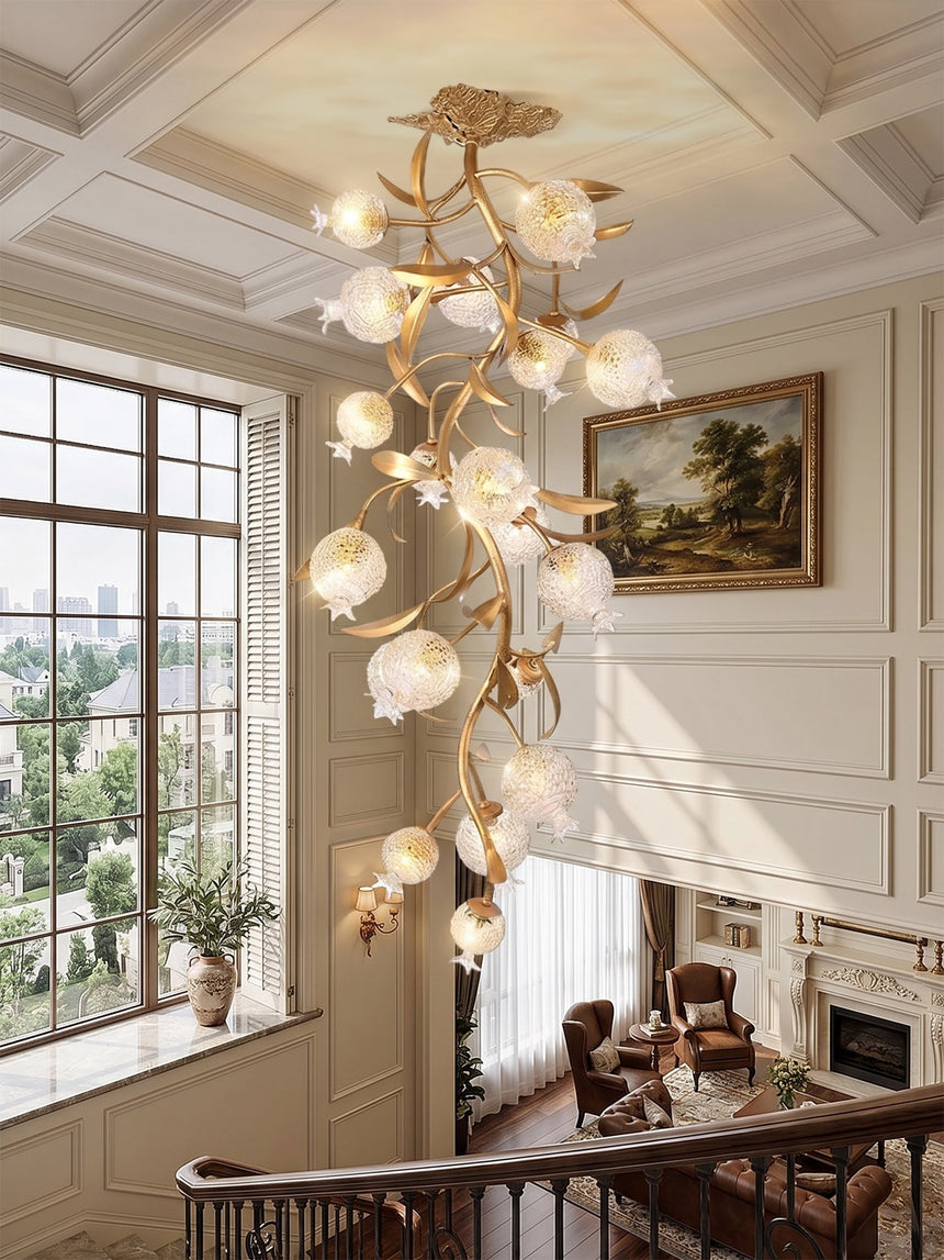 Brass branch chandelier under a coffered ceiling beside a window