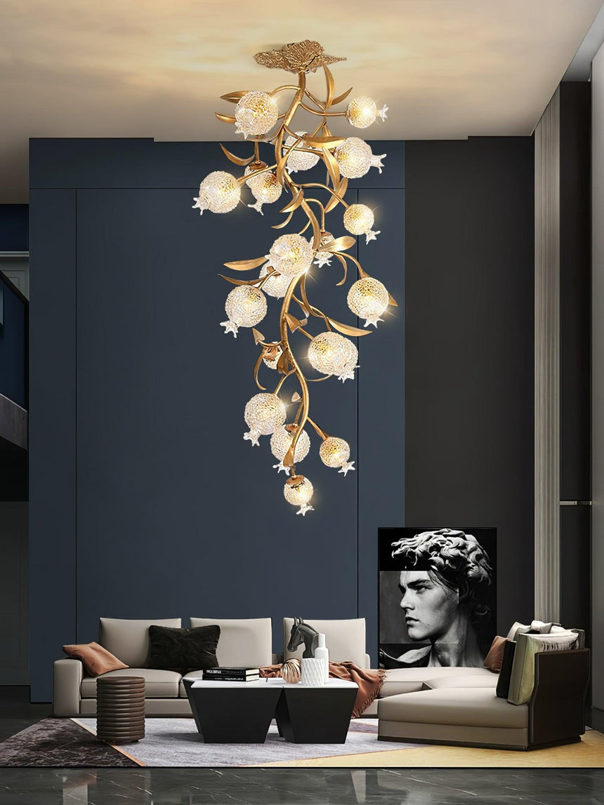 Brass branch chandelier in a dark blue living room with a bust