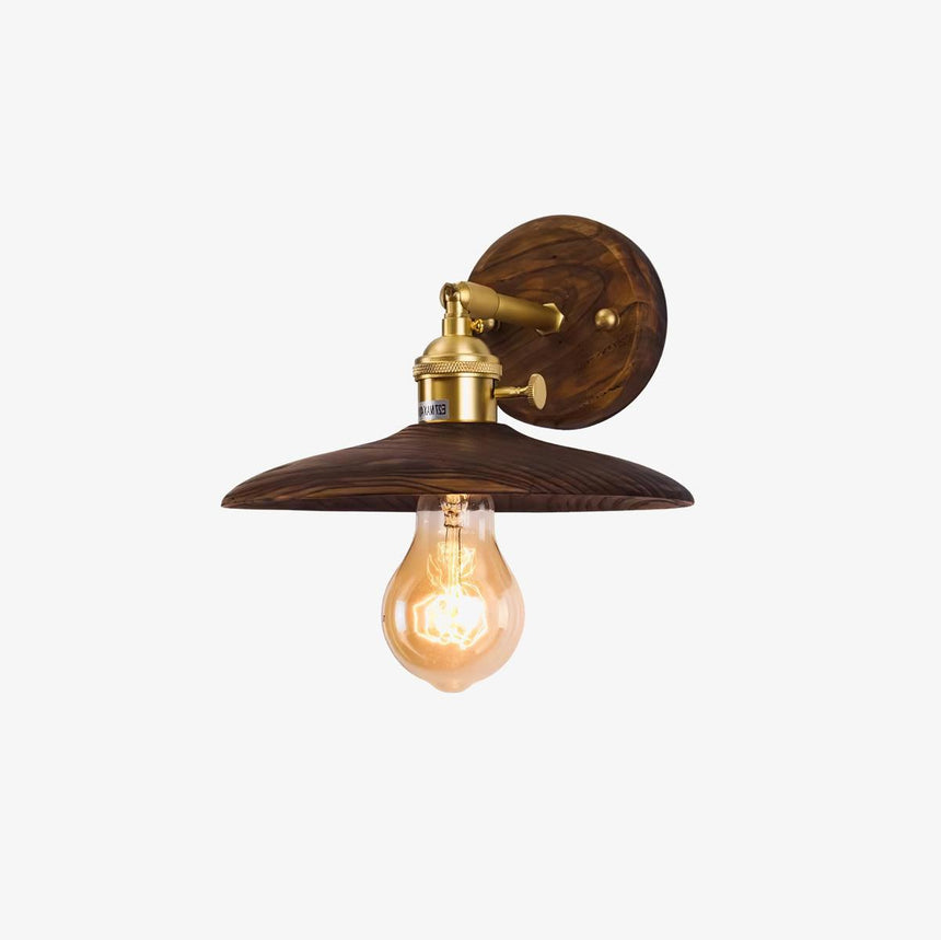 Detail of the wide flared walnut shade and the brass socket below it