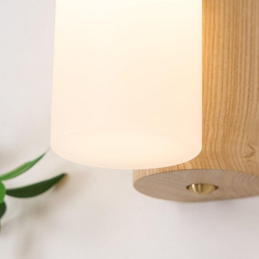 Close view of the lit diffuser where it meets the oak of the arch