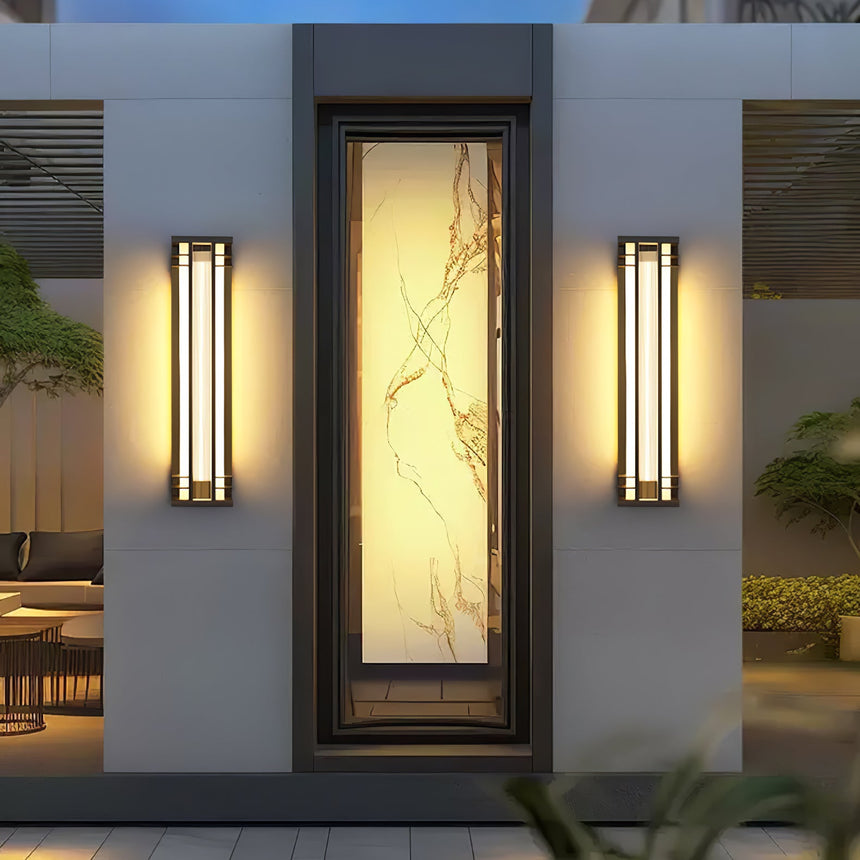 A pair flanking a tall lit panel on a render wall above a planter