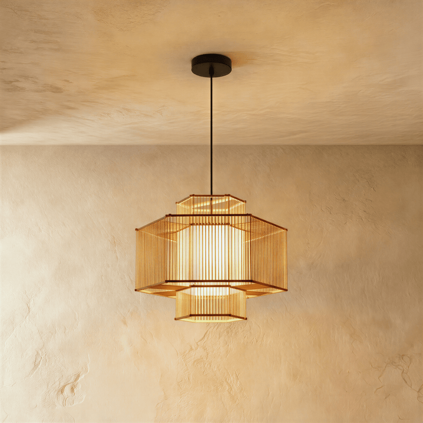 A small bamboo lantern built from two open rings around a lit core