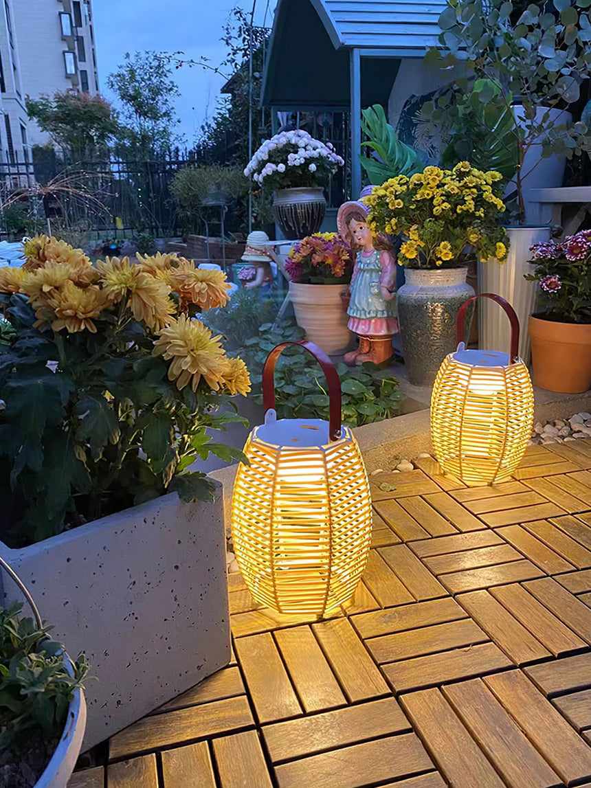Two lit on a timber deck beside planters of autumn flowers