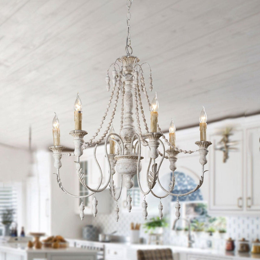 Lit under a white plank ceiling in a kitchen above a counter with plants