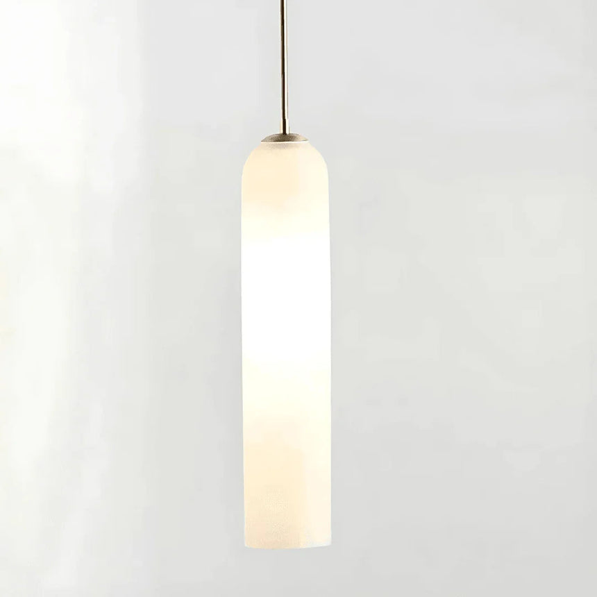 The white glass tube shown lit against a pale background