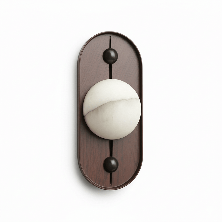 Alabaster orb showing its veining, set on a tall oval walnut plate