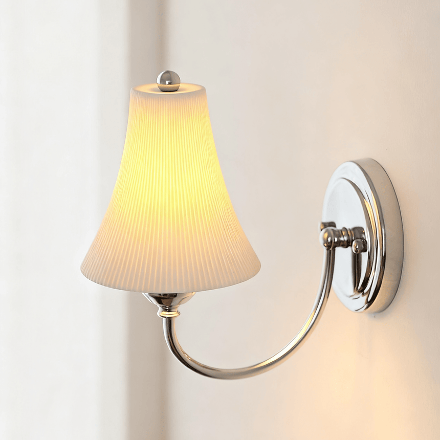 Close view of the ribbed bell shade and the chrome finial on top