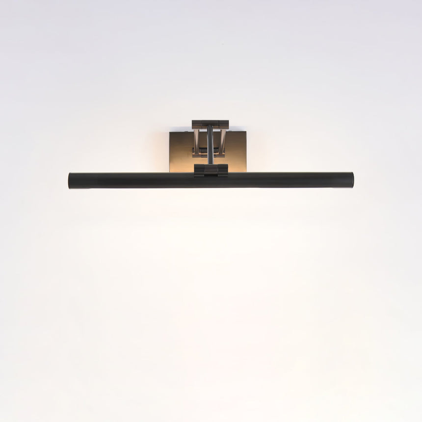 The longest black bar lit on a pale wall, the light reaching wall to wall below