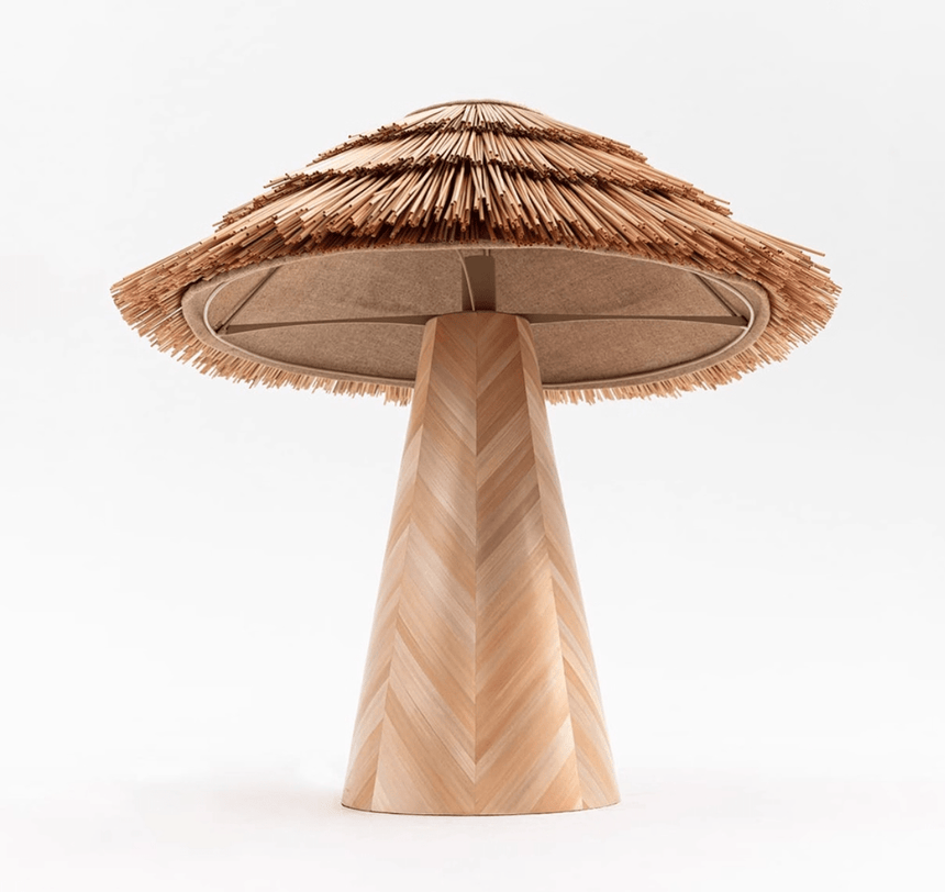 The straw shade seen from below, the frame visible inside the tiers