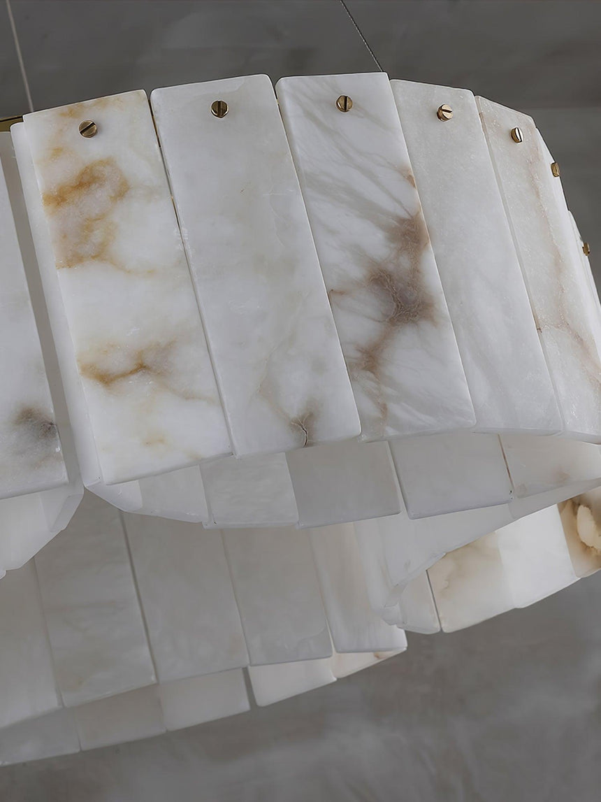 Close view of the lower row of alabaster panels and the brass pins