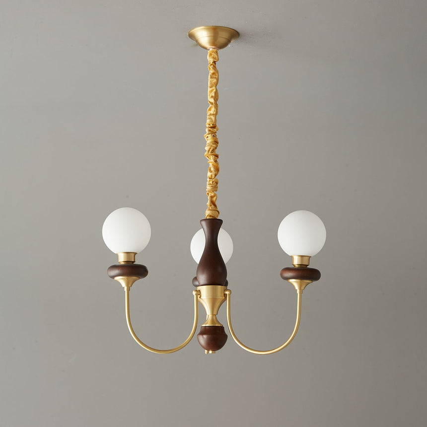 The three light build, three white glass balls on a walnut column
