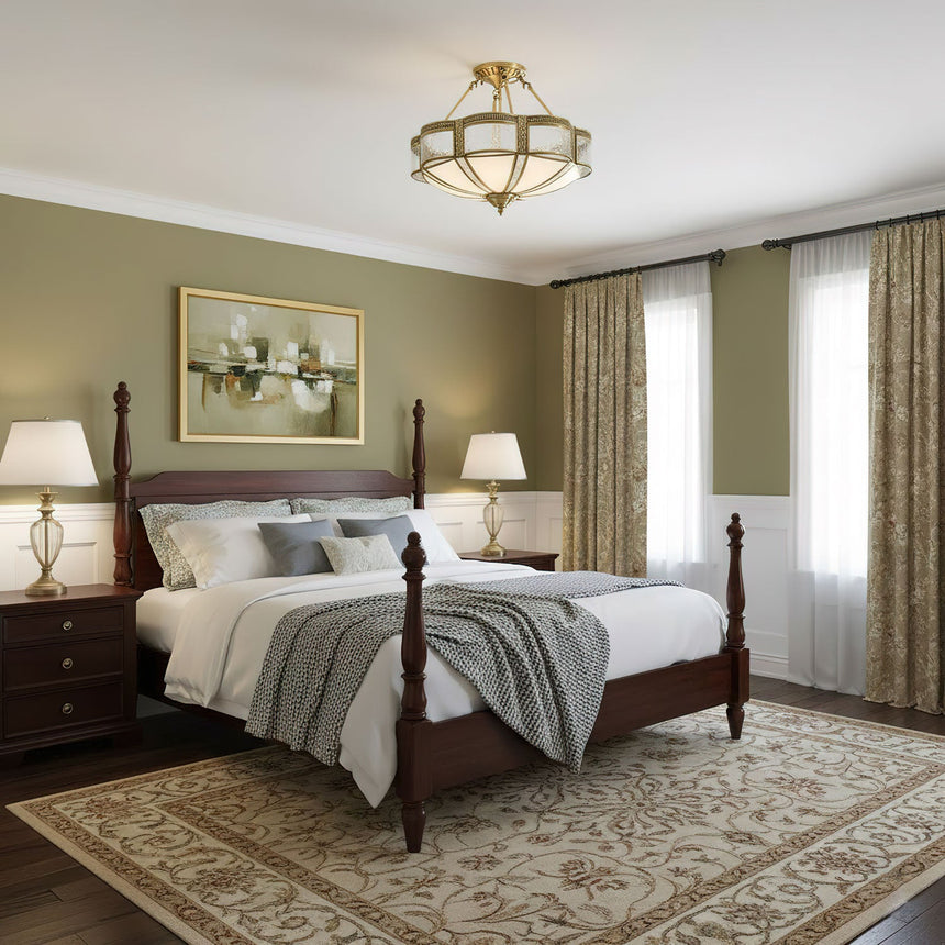 Brass and milk glass ceiling light in a bedroom with green curtains