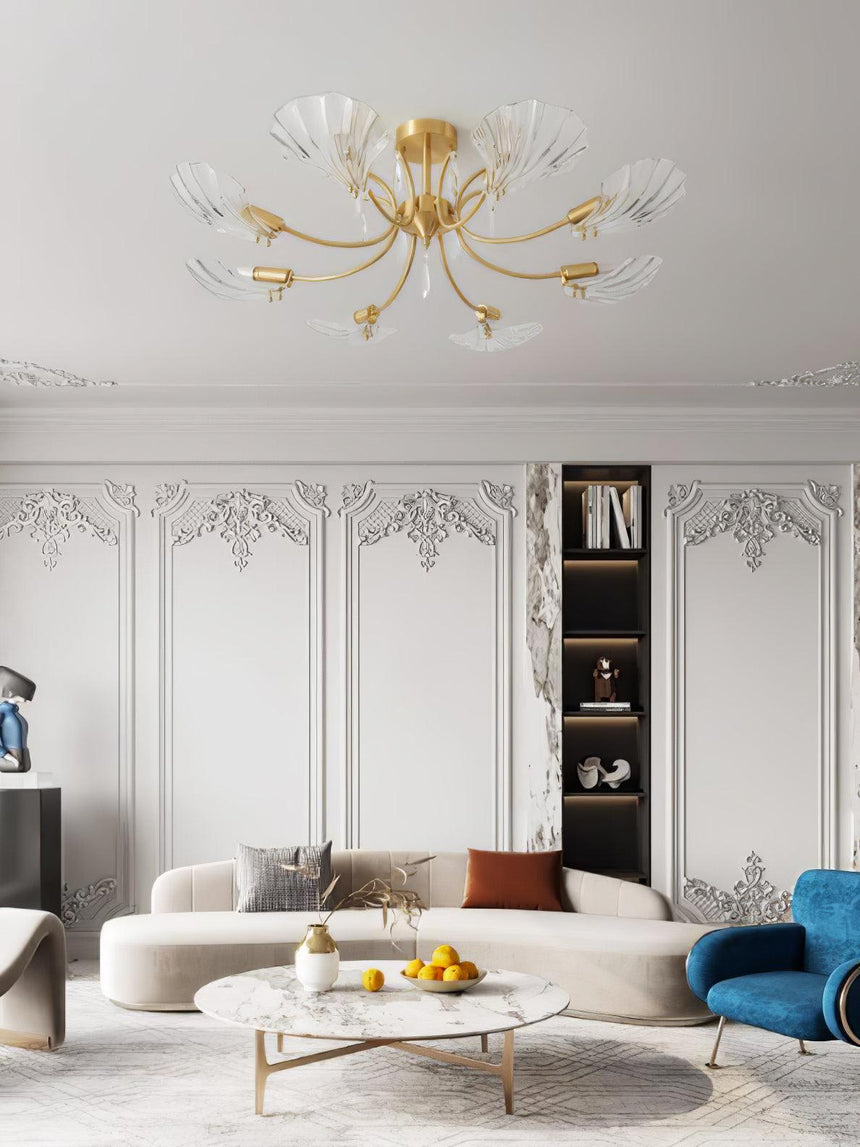Shell shade ceiling light in a living room with a blue armchair