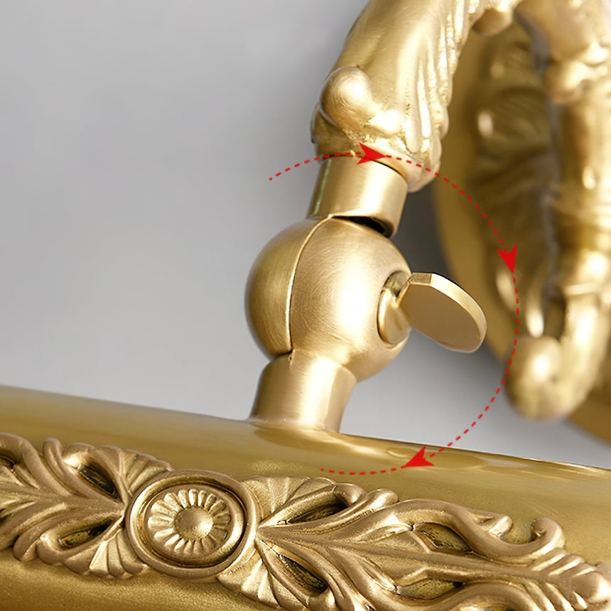 Close view of the joint behind the tube where it meets the scrolled arm