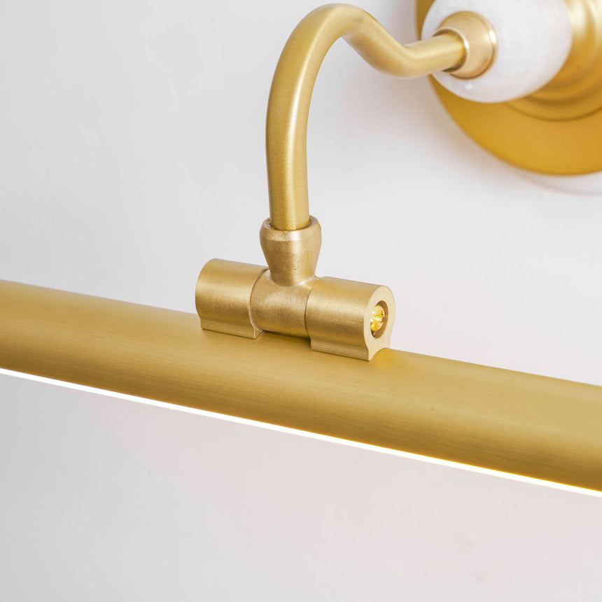 Close view of the curved arm meeting the tube at a small collar
