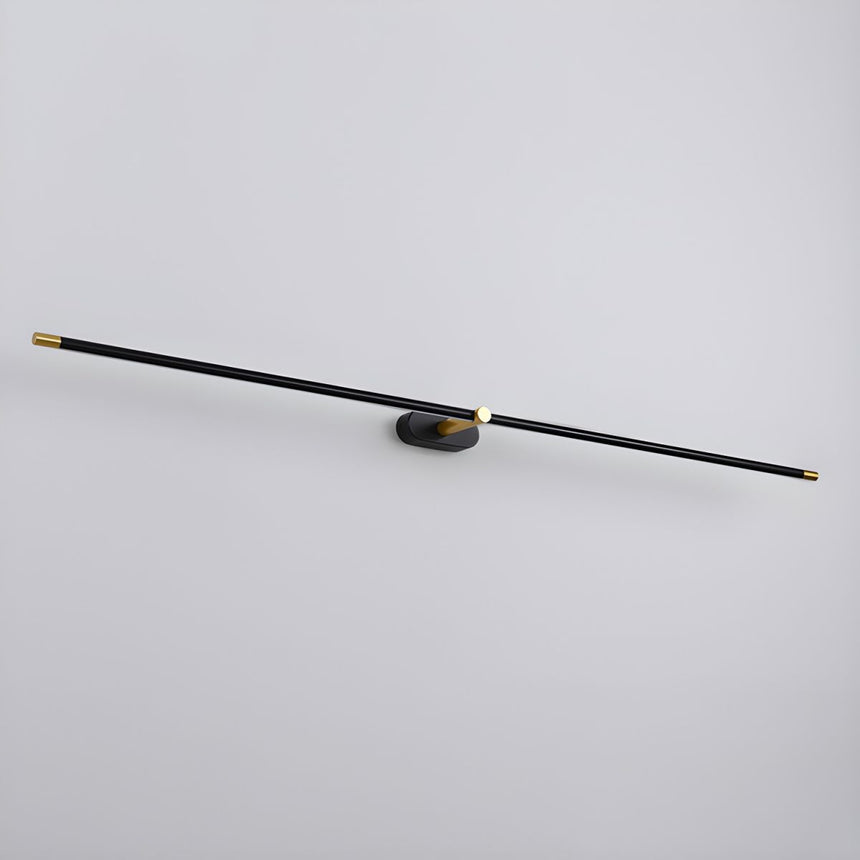 The rod seen at an angle against a pale wall, thin from end to end