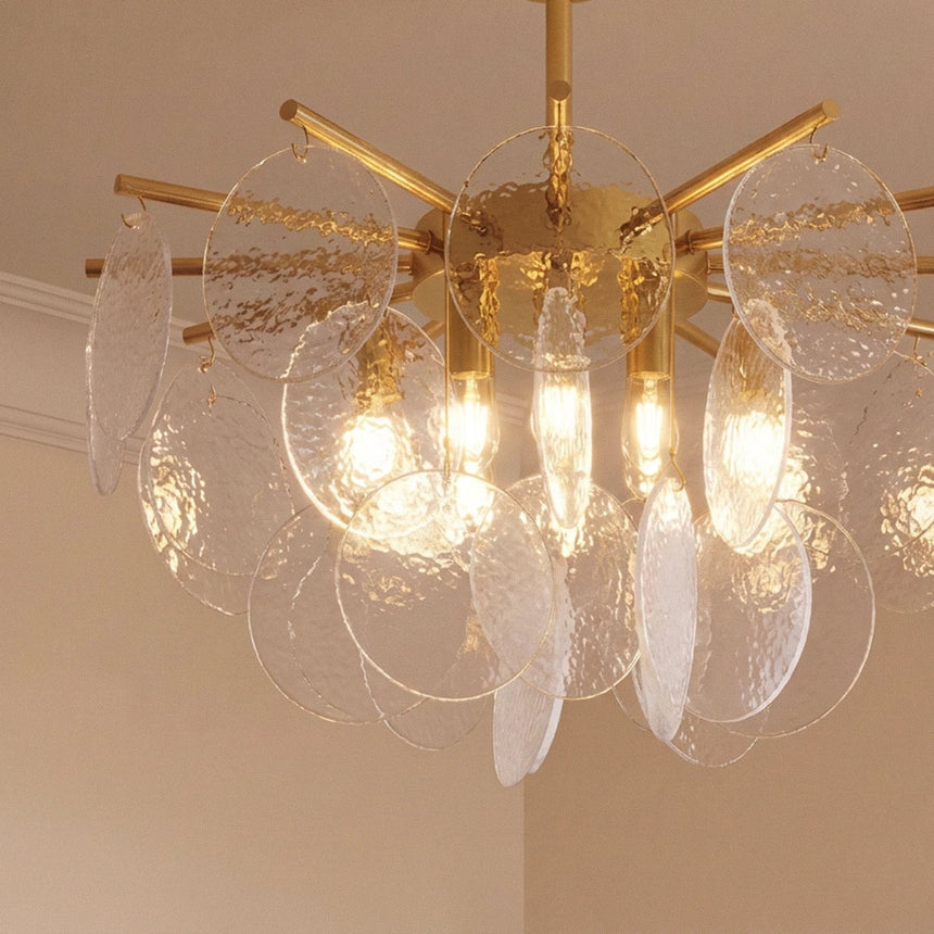 The same gold hub with clear bubbled glass discs hanging in overlapping tiers