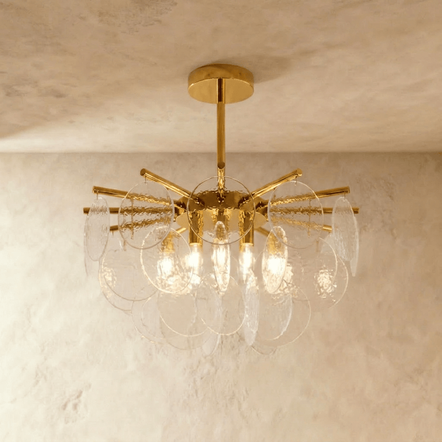 A gold hub with radiating rods carrying tiers of frosted bubbled glass discs