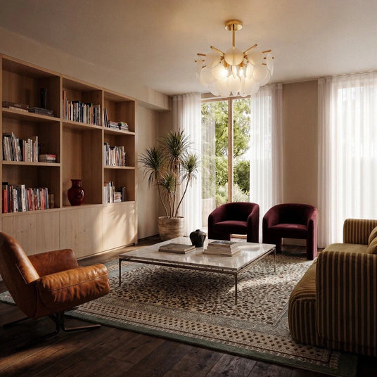 The fitting lit in a living room above a bookcase, armchairs and a patterned rug