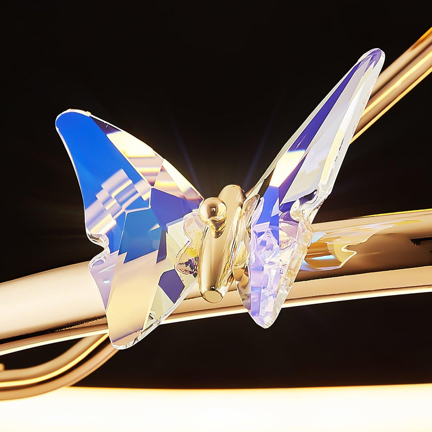 Close view of the iridescent crystal butterfly on the gold ring