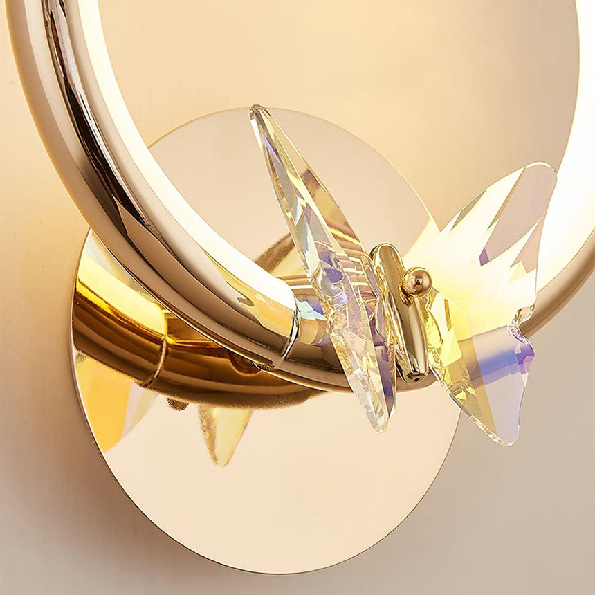 Close view of the butterfly and the polished gold wall plate