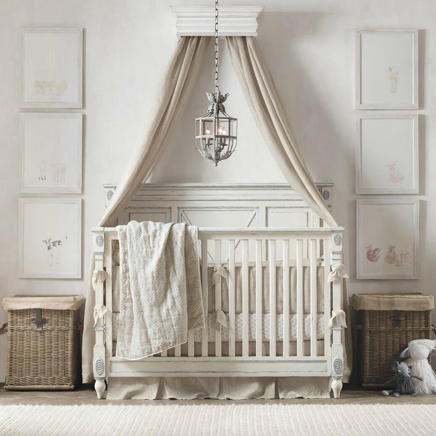 Lit above a crib under a fabric canopy with woven baskets alongside