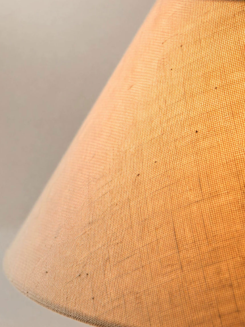 Close view of the linen weave of the shade lit from inside