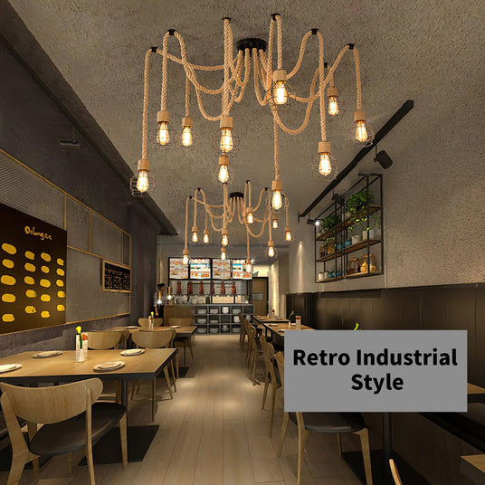 Lit down a long cafe with tables, chairs and a counter at the far end