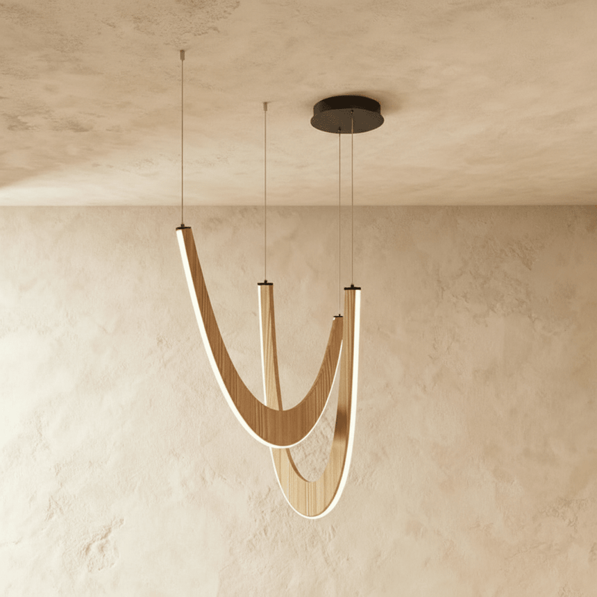 The same pair of arcs in pale wood, the lit line running the whole inner curve